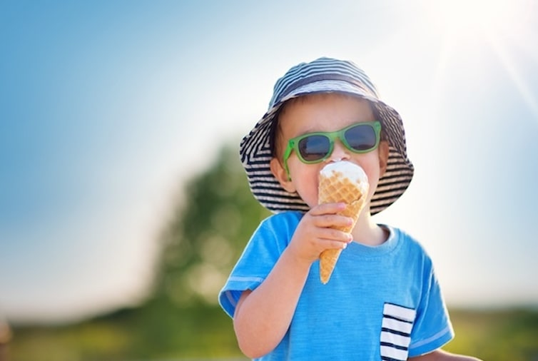 child eating ice cream on a summers day
